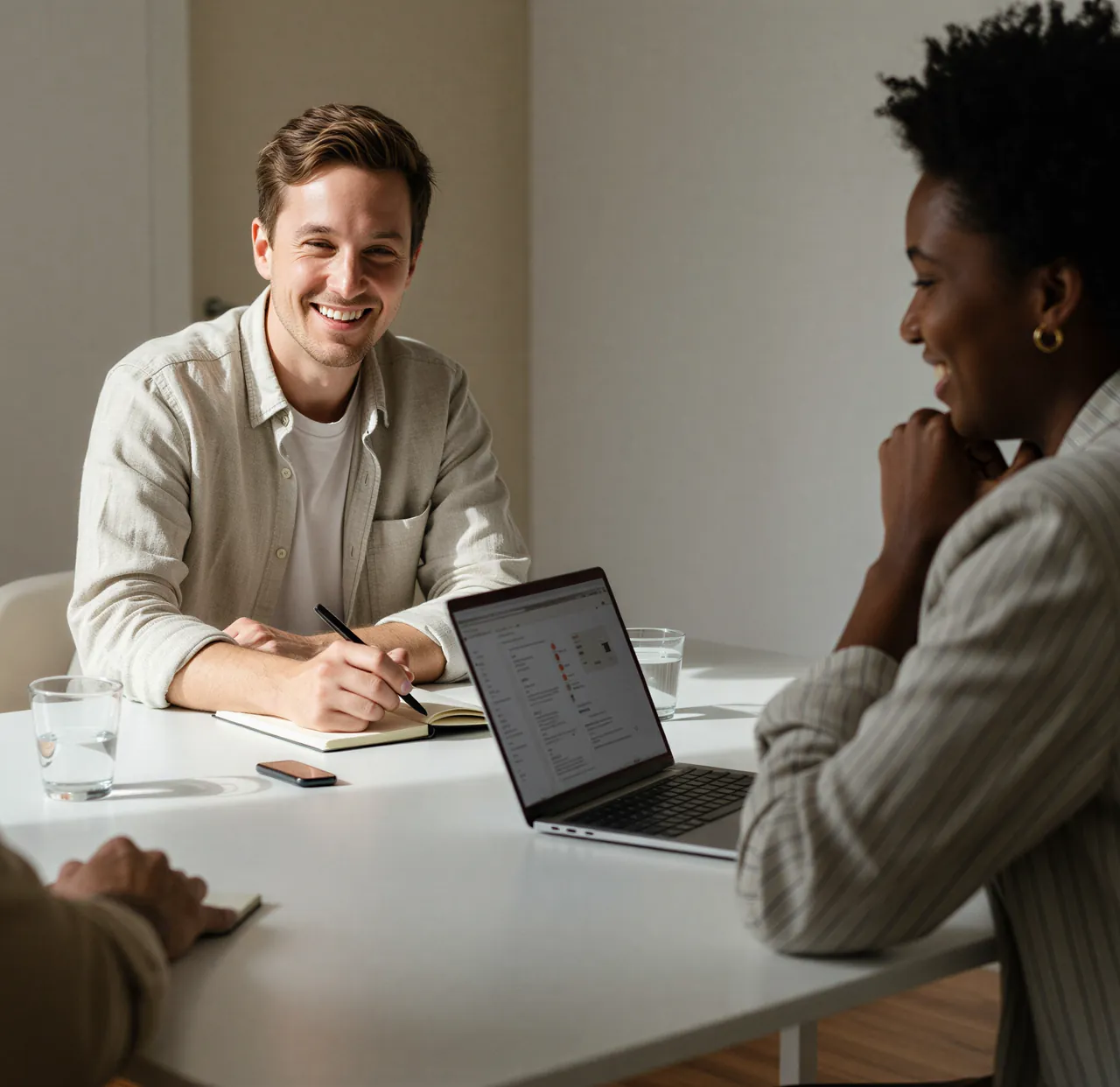 Two colleagues working together at a studio table