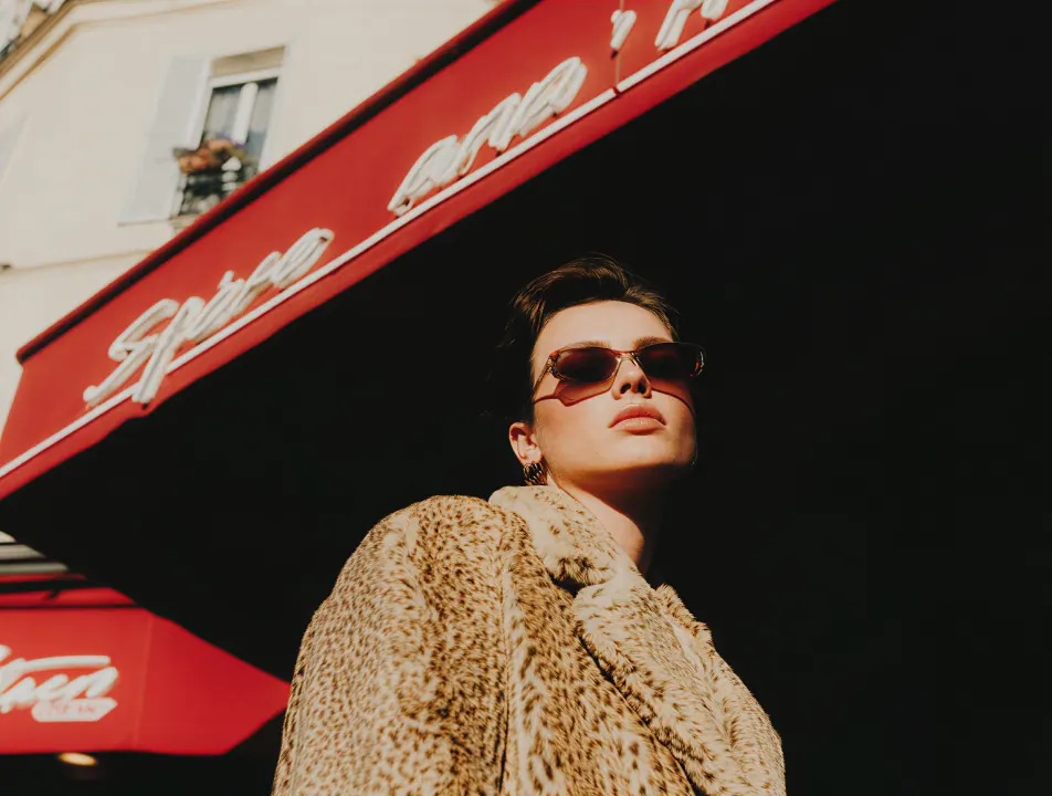 Northline live issue still — figure under a red awning